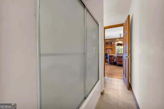 a white toilet sitting next to a bathroom sink and vanity