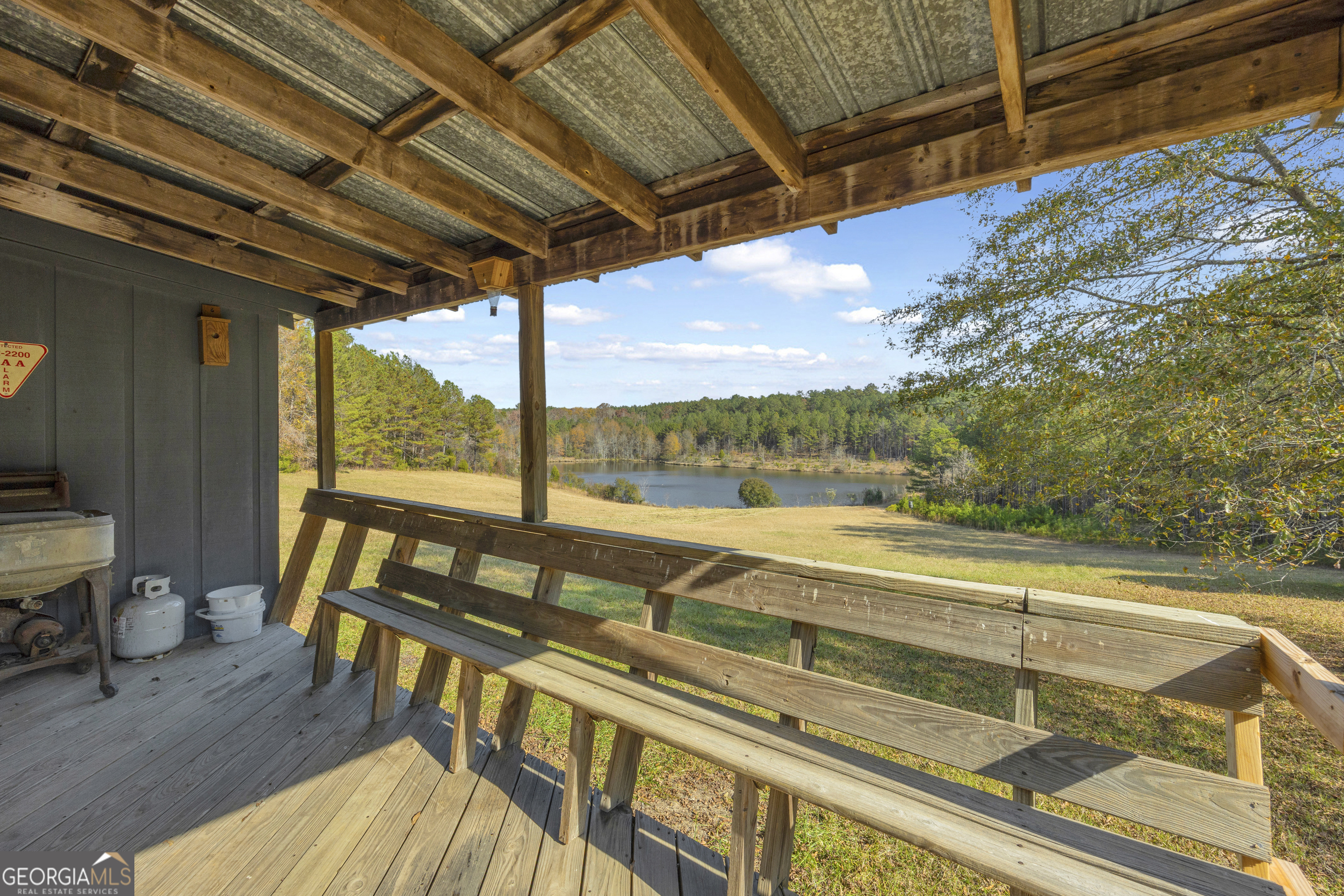 23824 Highway 22 Sparta, GA 31087 - Photo 40 of 94 a view of a balcony with furniture and wooden floor