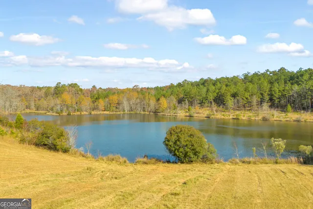 a room with pool table and windows