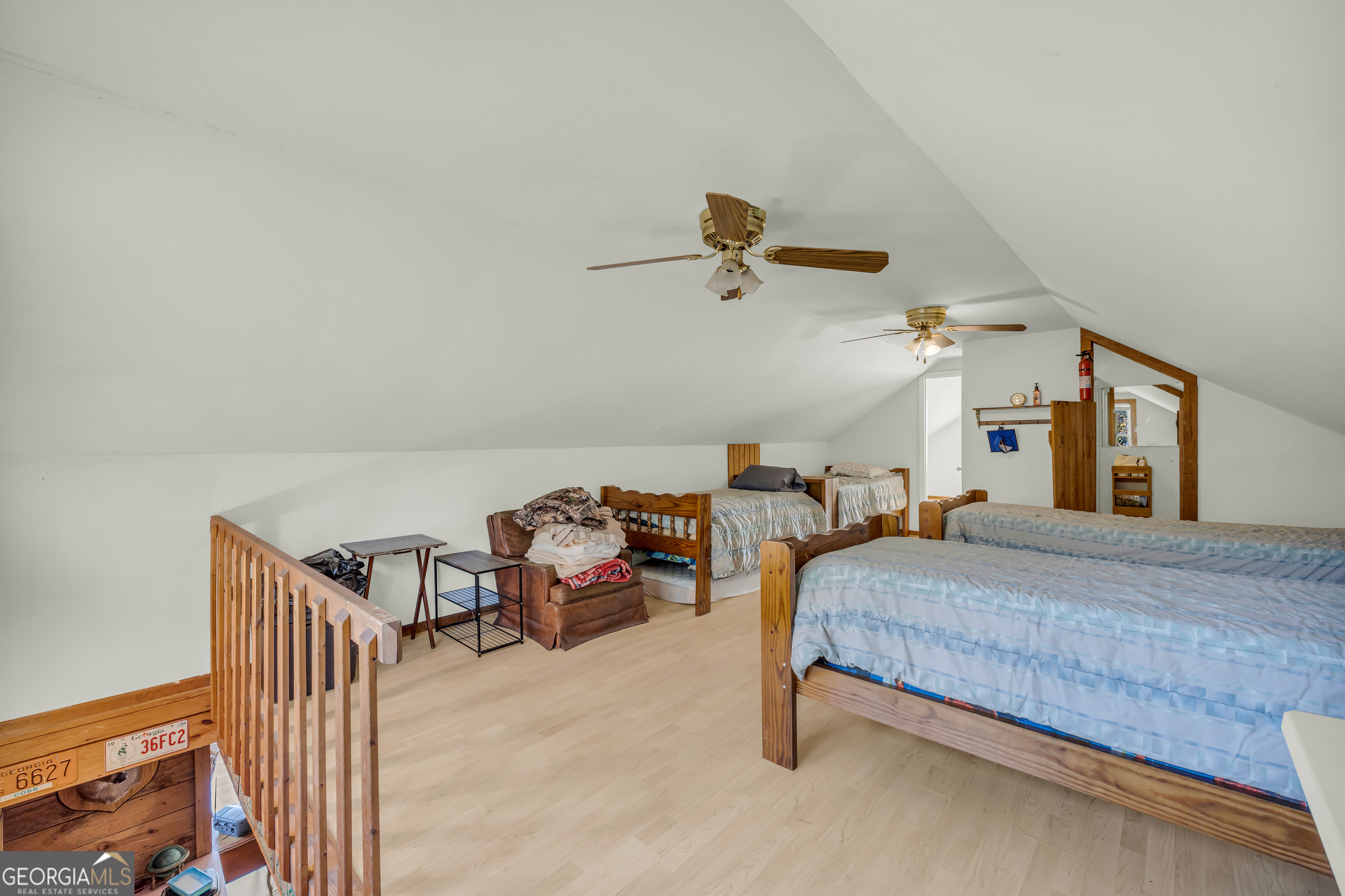 23824 Highway 22 Sparta, GA 31087 - Photo 42 of 94 a bedroom with a bed and a chandelier