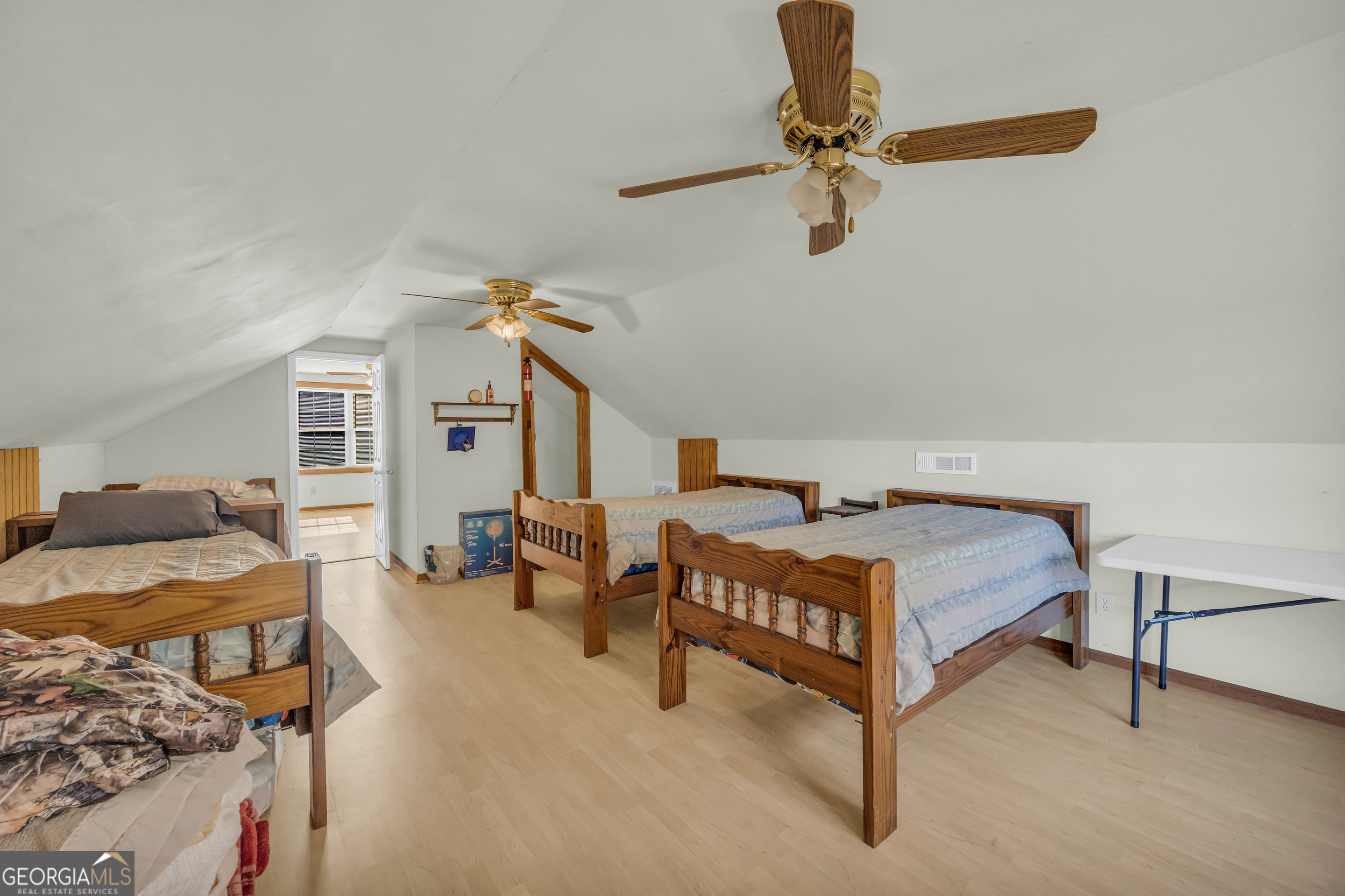 23824 Highway 22 Sparta, GA 31087 - Photo 43 of 94 a bedroom with furniture and a chair