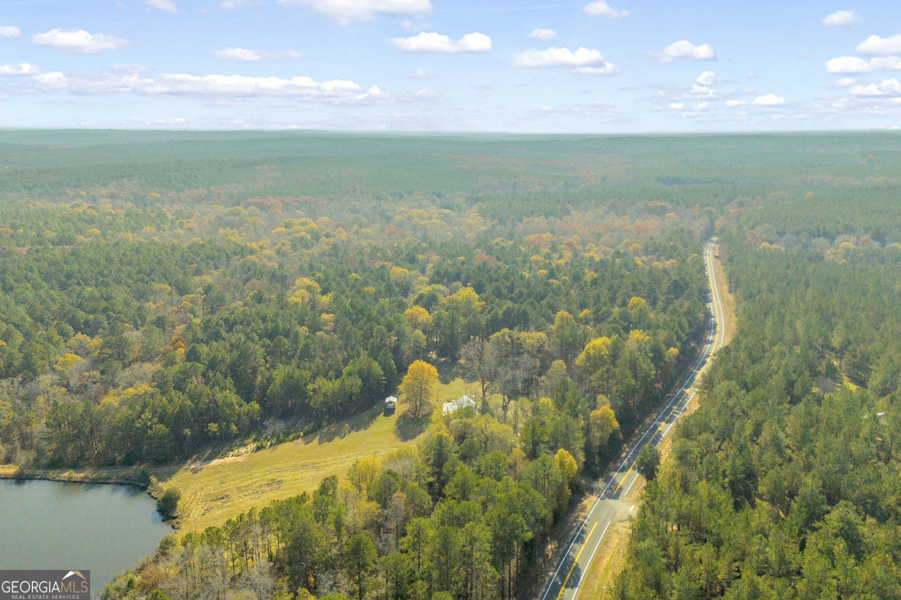 23824 Highway 22 Sparta, GA 31087 - Photo 64 of 94 a view of a lake with a yard