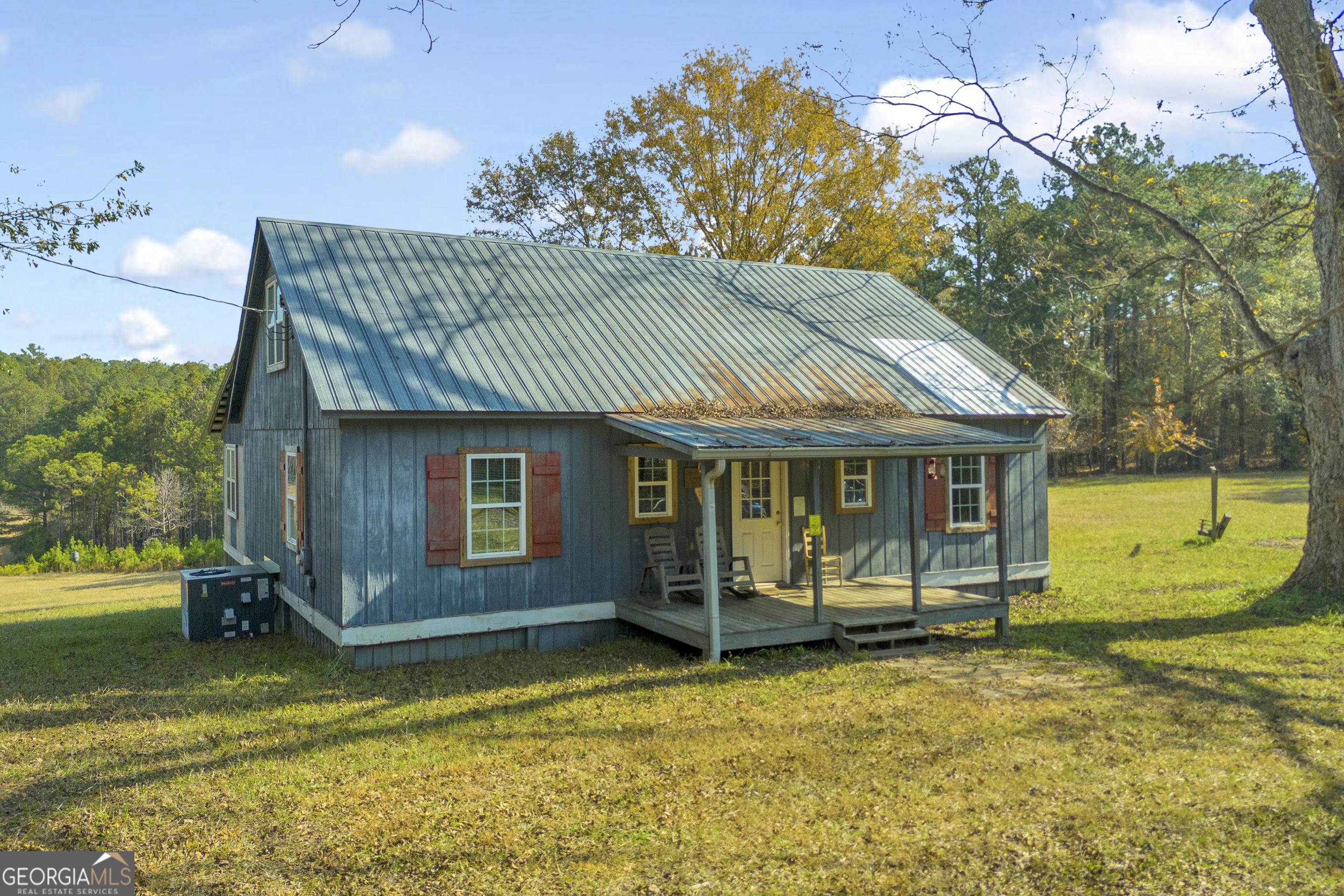 23824 Highway 22 Sparta, GA 31087 - Photo 70 of 94 a front view of a house with a yard