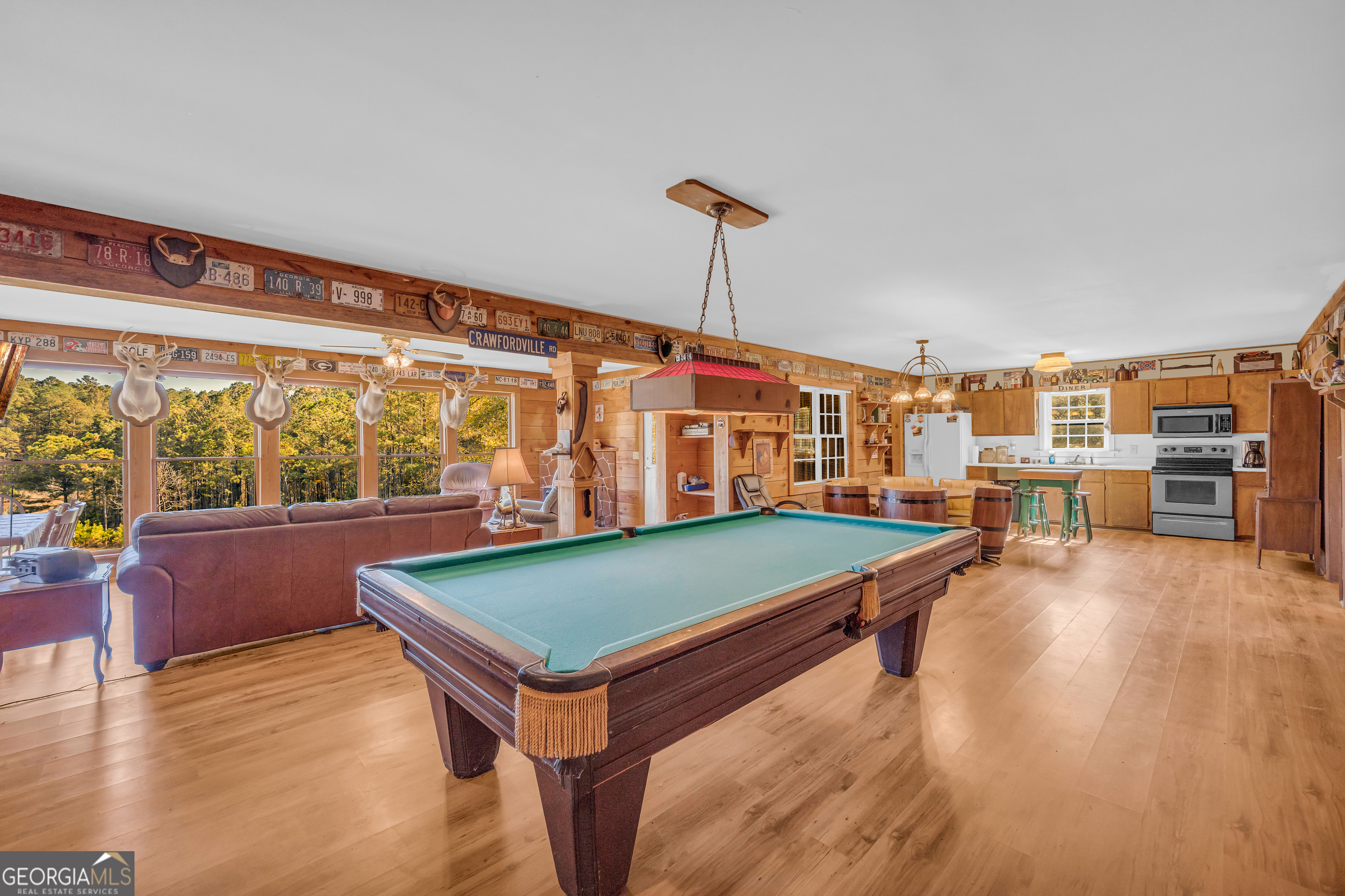 23824 Highway 22 Sparta, GA 31087 - Photo 8 of 94 a room with pool table and windows