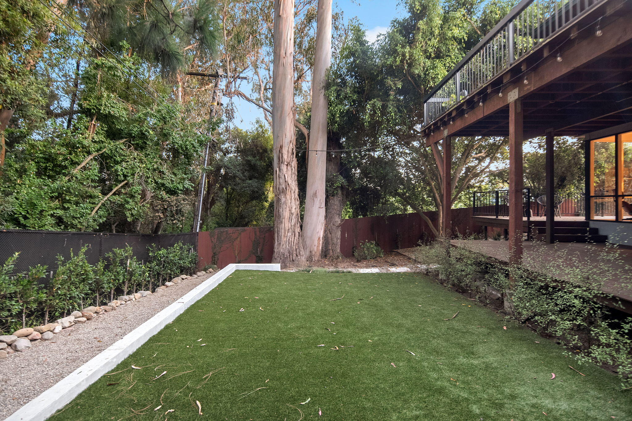 180 Hermosillo Road Montecito, CA 93108 - Photo 24 of 56 a view of a backyard with large trees