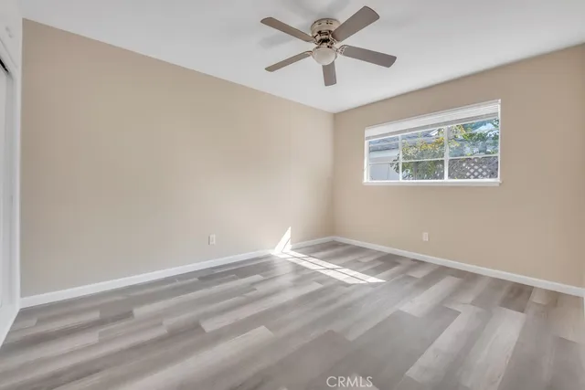 a bathroom with a sink a toilet and a window