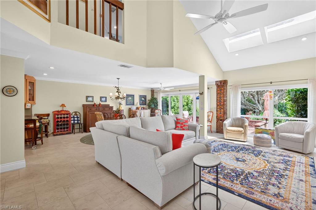 4030 Crayton Road, Unit C2 Naples, FL 34103 - Photo 18 of 32 a living room with furniture and a large window