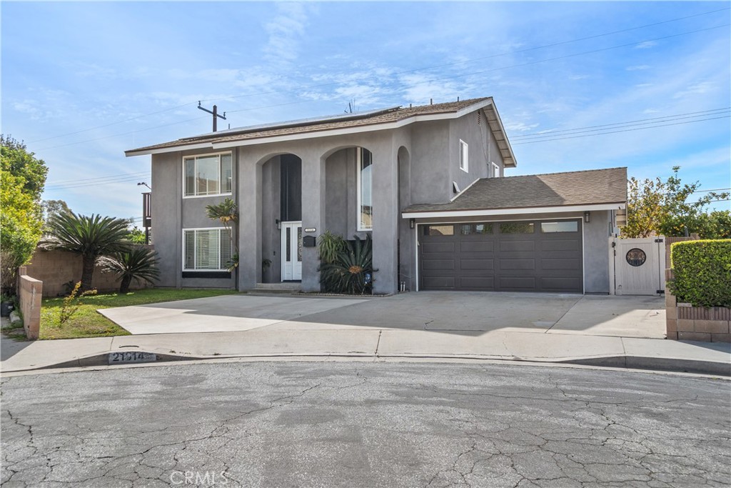 21314 Kinard Avenue Carson, CA 90745 - Photo 1 of 1 a front view of a house with a yard and garage