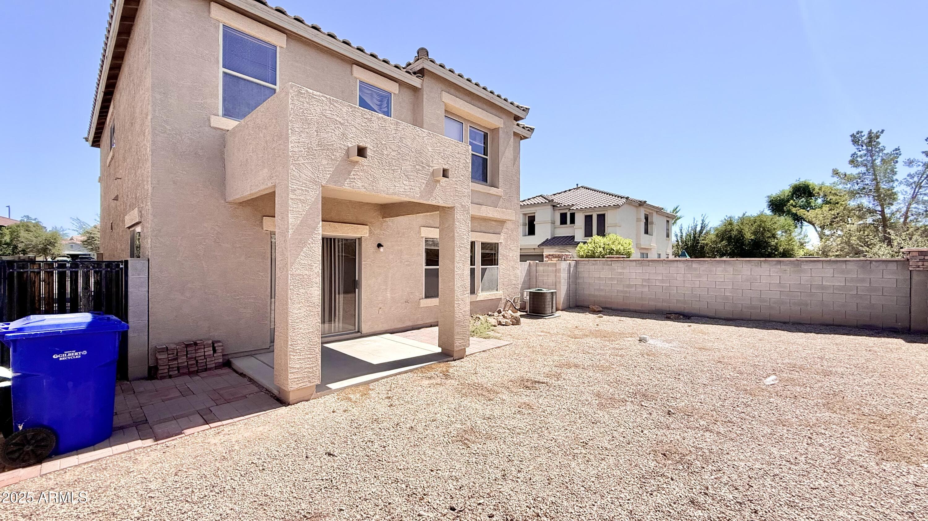 2499 South Marble Street Gilbert, AZ 85295 - Photo 17 of 21 a backyard of a house with seating space