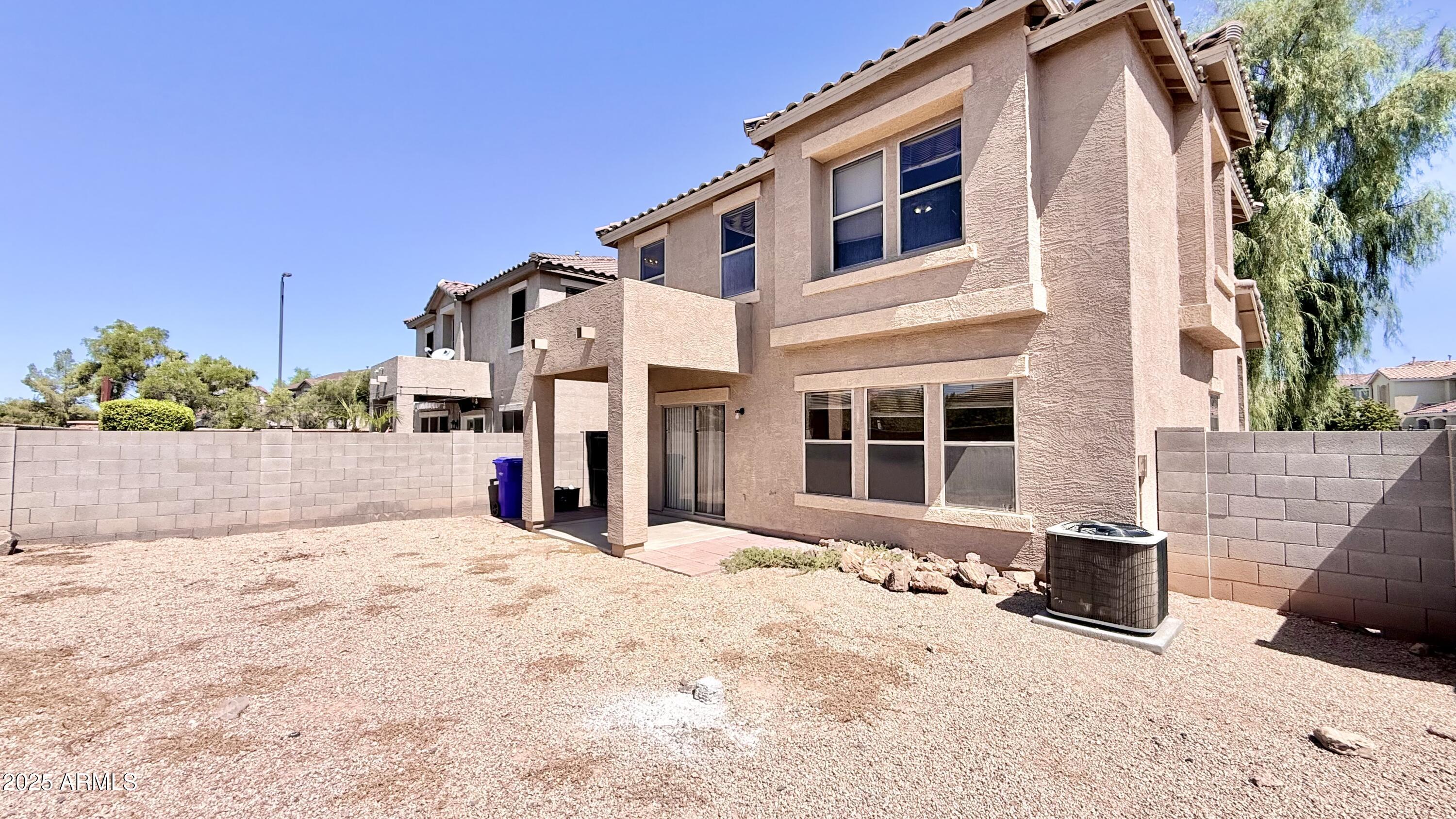 2499 South Marble Street Gilbert, AZ 85295 - Photo 18 of 21 a front view of a house with a yard