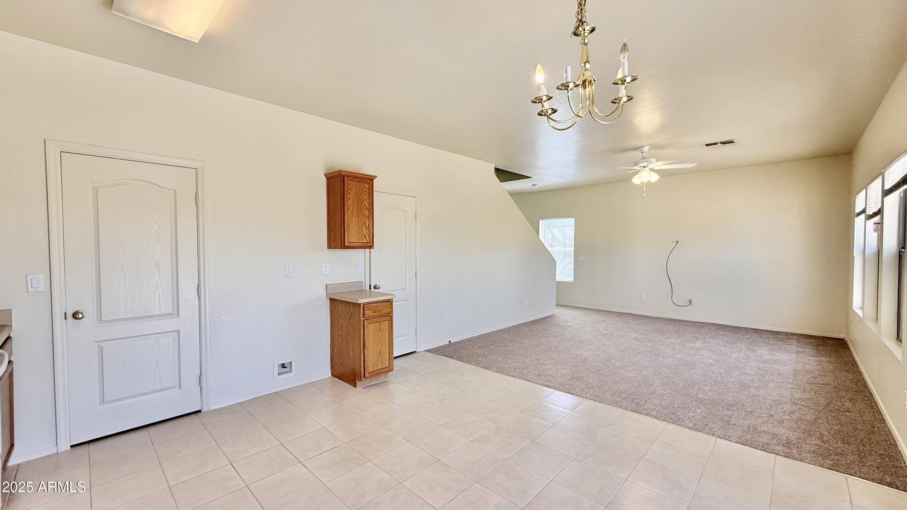 2499 South Marble Street Gilbert, AZ 85295 - Photo 5 of 21 wooden floor in an empty room with a window