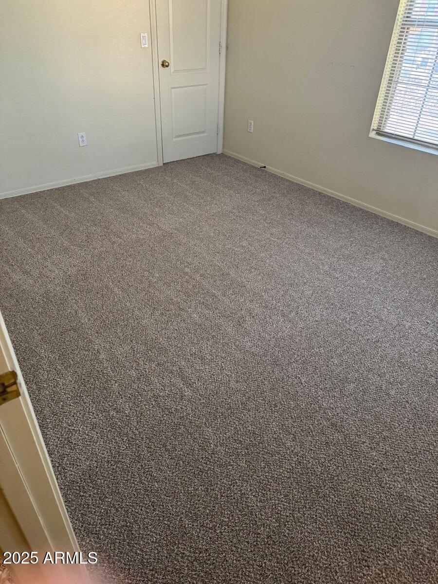 2499 South Marble Street Gilbert, AZ 85295 - Photo 6 of 21 an empty room with windows