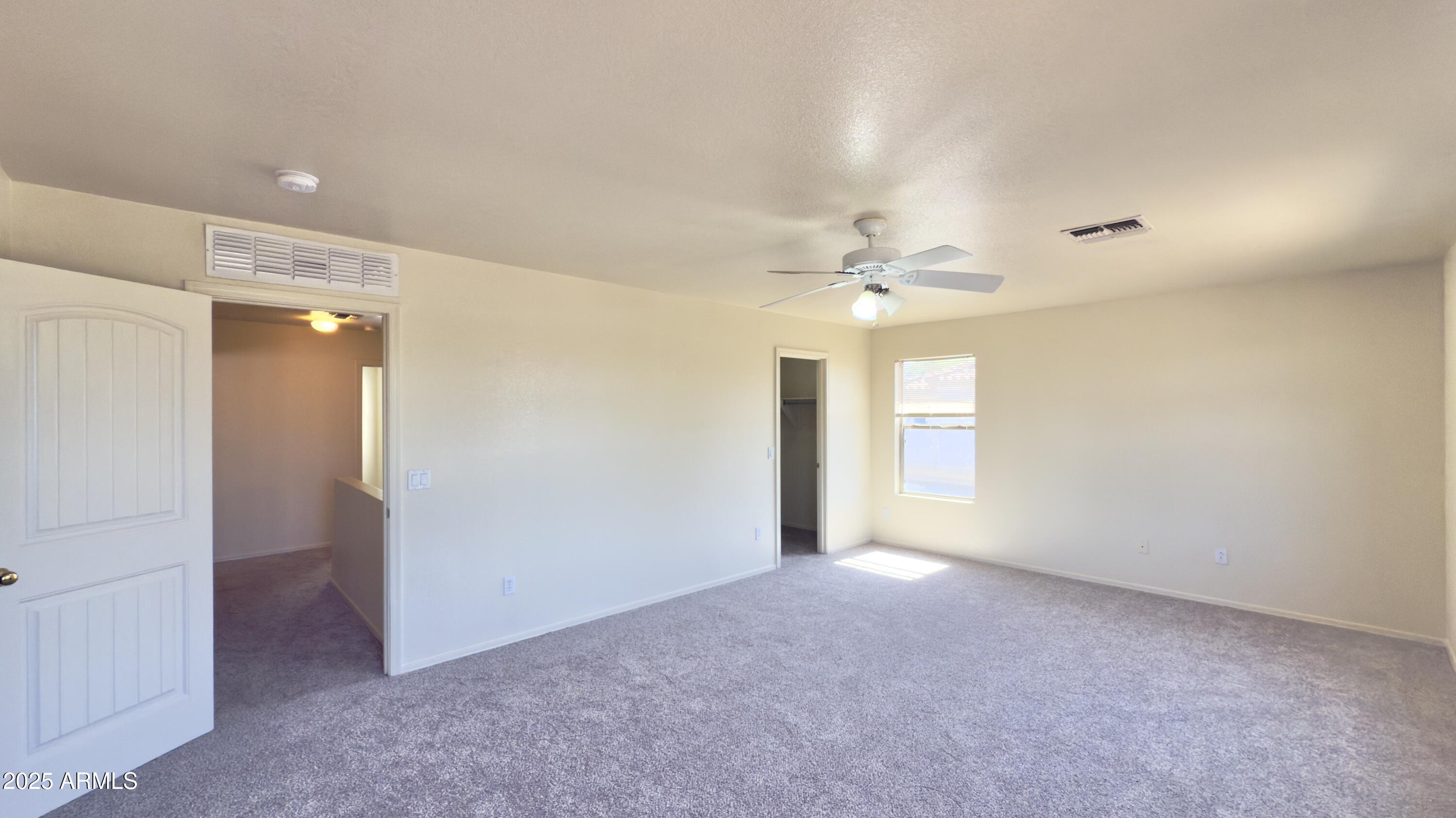 2499 South Marble Street Gilbert, AZ 85295 - Photo 7 of 21 a view of an empty room with a window