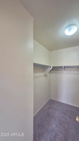 a view of an empty walk in closet