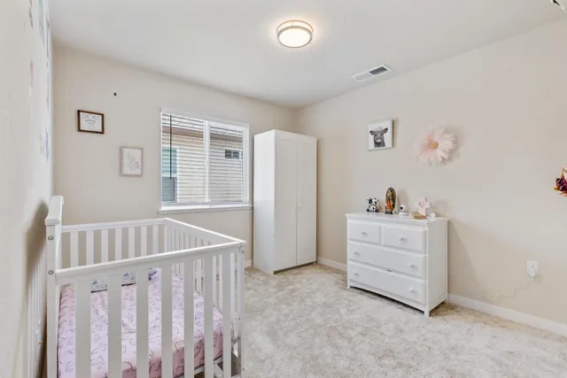 a view of room with furniture and wooden floor