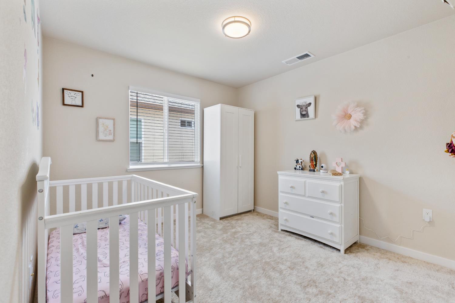 1202 Impression Street Turlock, CA 95380 - Photo 19 of 35 a view of room with furniture and wooden floor