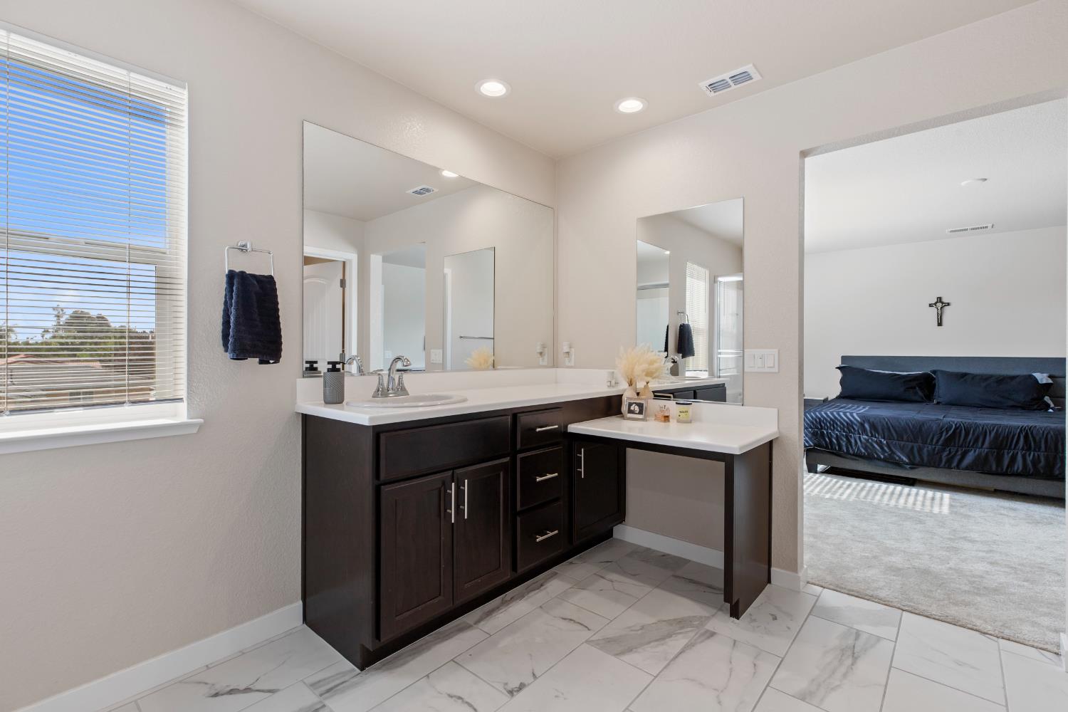 1202 Impression Street Turlock, CA 95380 - Photo 25 of 35 a spacious bathroom with a sink double vanity and a mirror