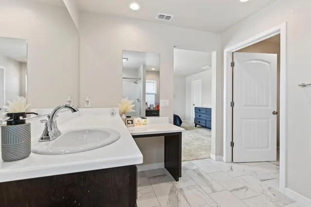 a view of a sink and a mirror
