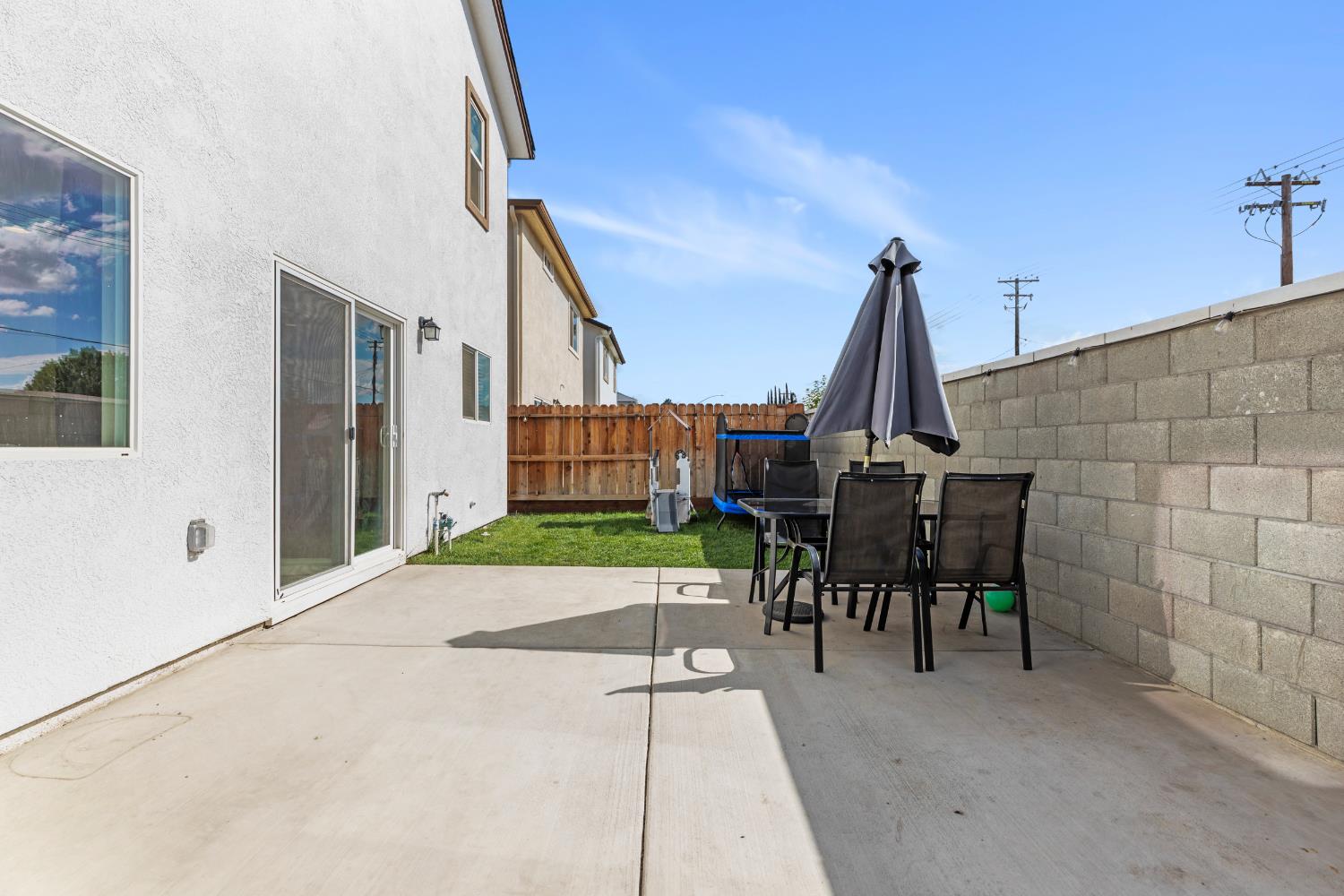 1202 Impression Street Turlock, CA 95380 - Photo 27 of 35 a view of a patio with a table and chairs