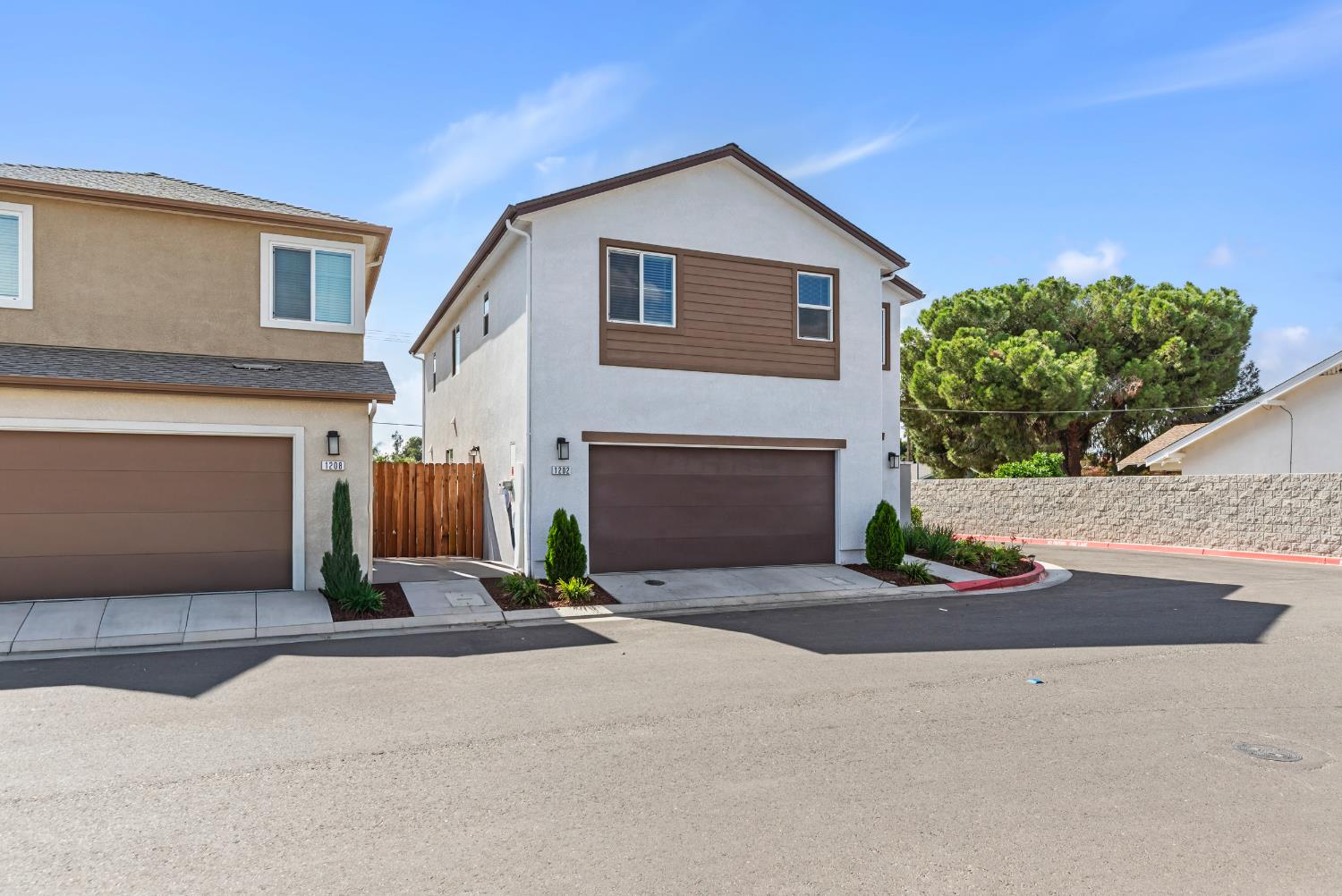 1202 Impression Street Turlock, CA 95380 - Photo 4 of 35 a front view of a house with yard