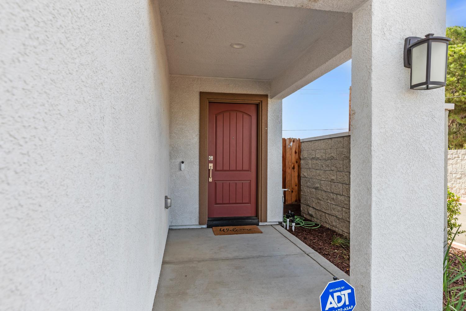 1202 Impression Street Turlock, CA 95380 - Photo 5 of 35 a view of front door