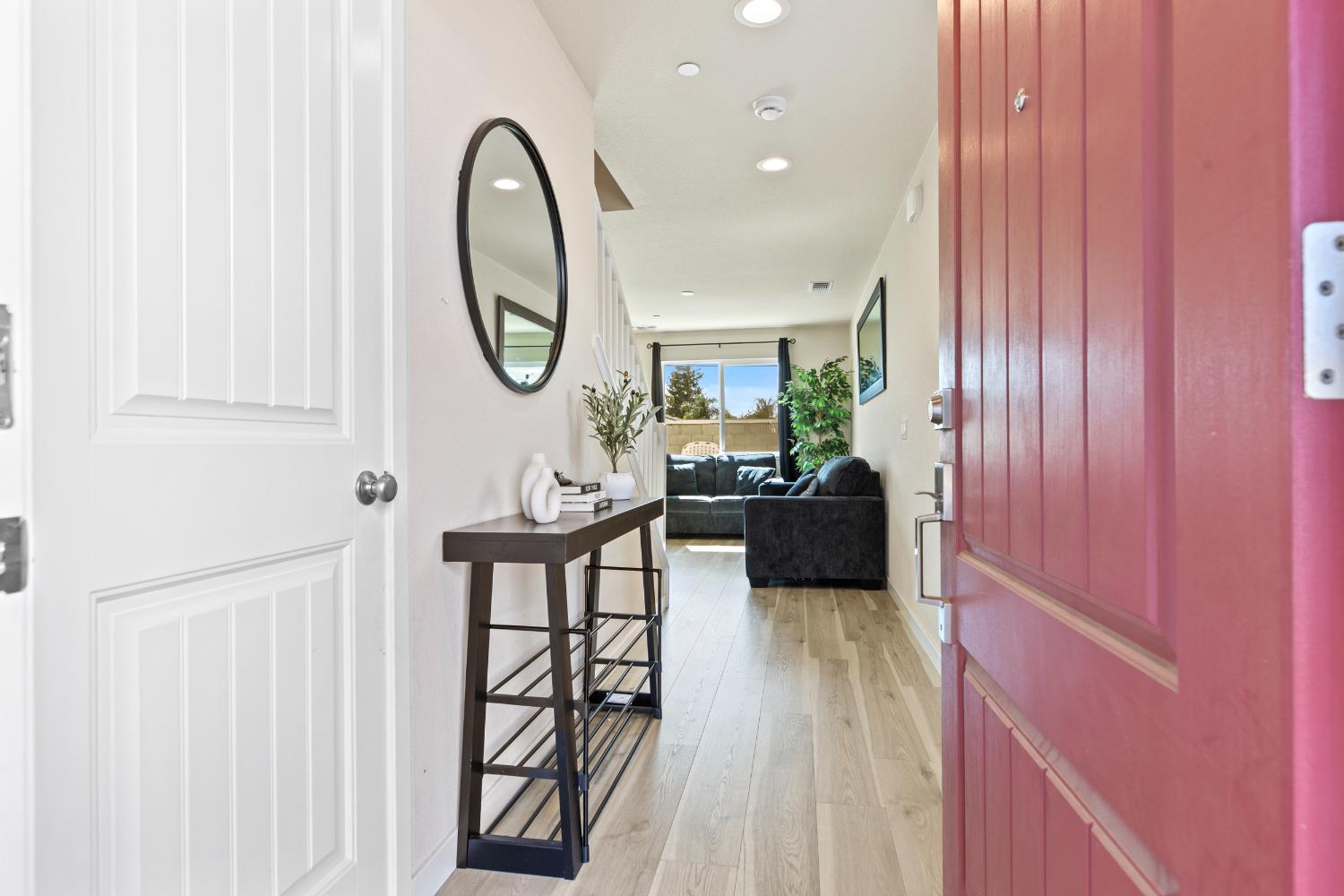 1202 Impression Street Turlock, CA 95380 - Photo 6 of 35 a living room with furniture a table and a potted plant
