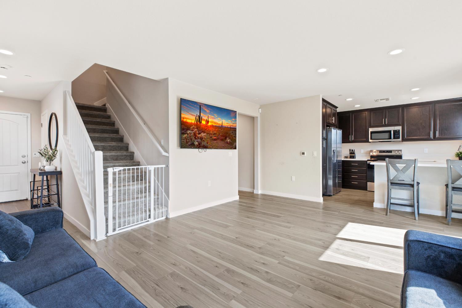 1202 Impression Street Turlock, CA 95380 - Photo 10 of 35 a view of kitchen with furniture and wooden floor