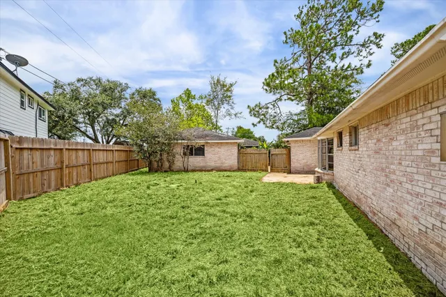 a backyard of a house with lots of green space