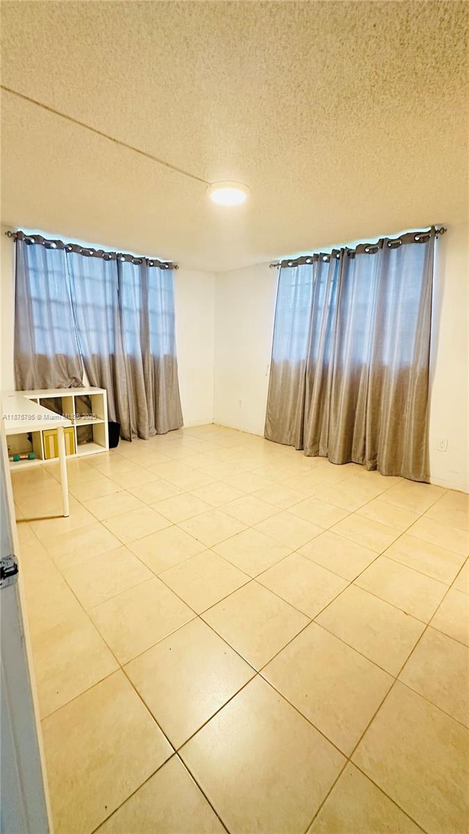 7100 Northwest 17th Street, Unit 111 Plantation, FL 33313 - Photo 7 of 18 a view of a backyard