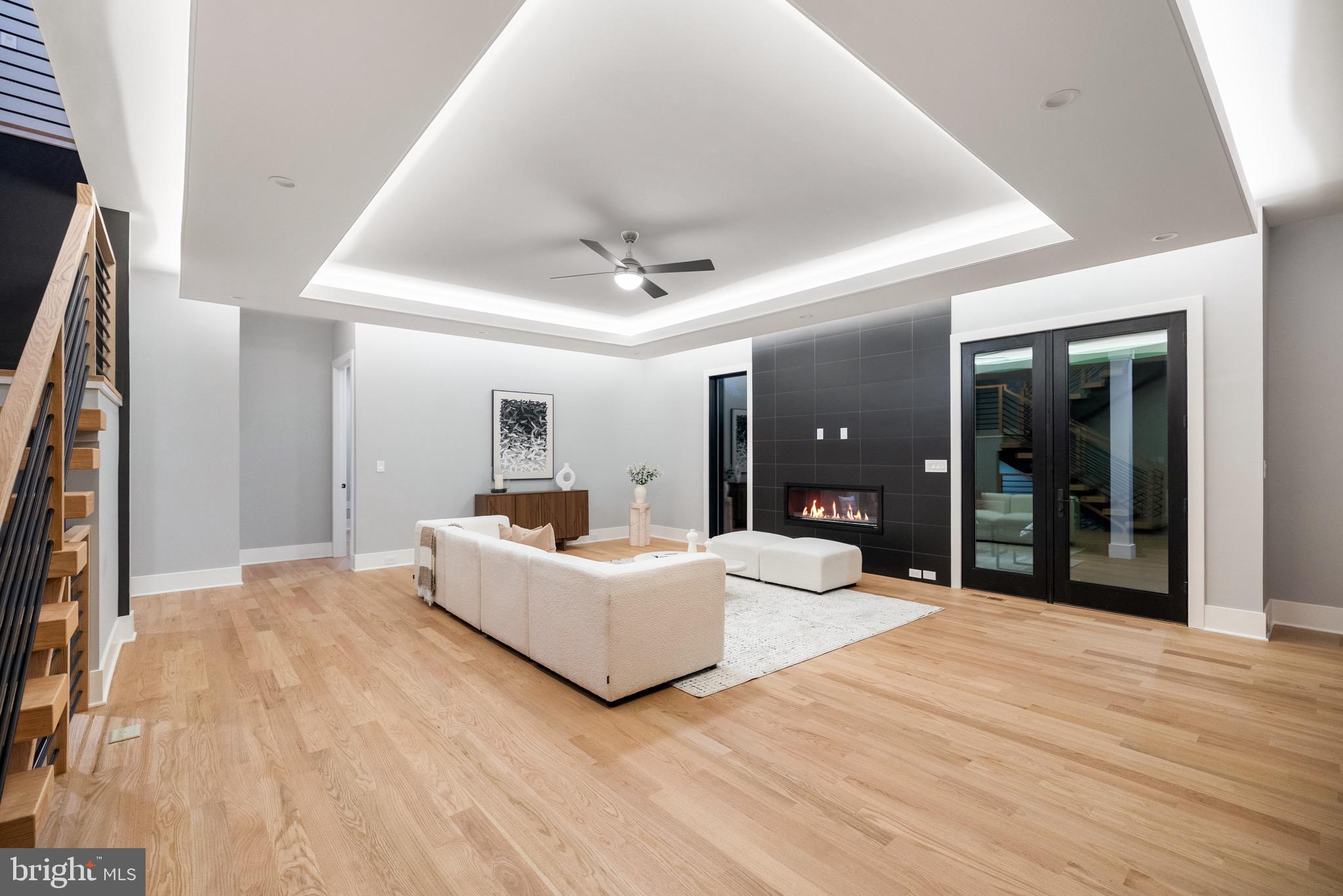 1052 Balls Hill Road McLean, VA 22101 - Photo 13 of 41 a living room with a balcony furniture and a ceiling fan
