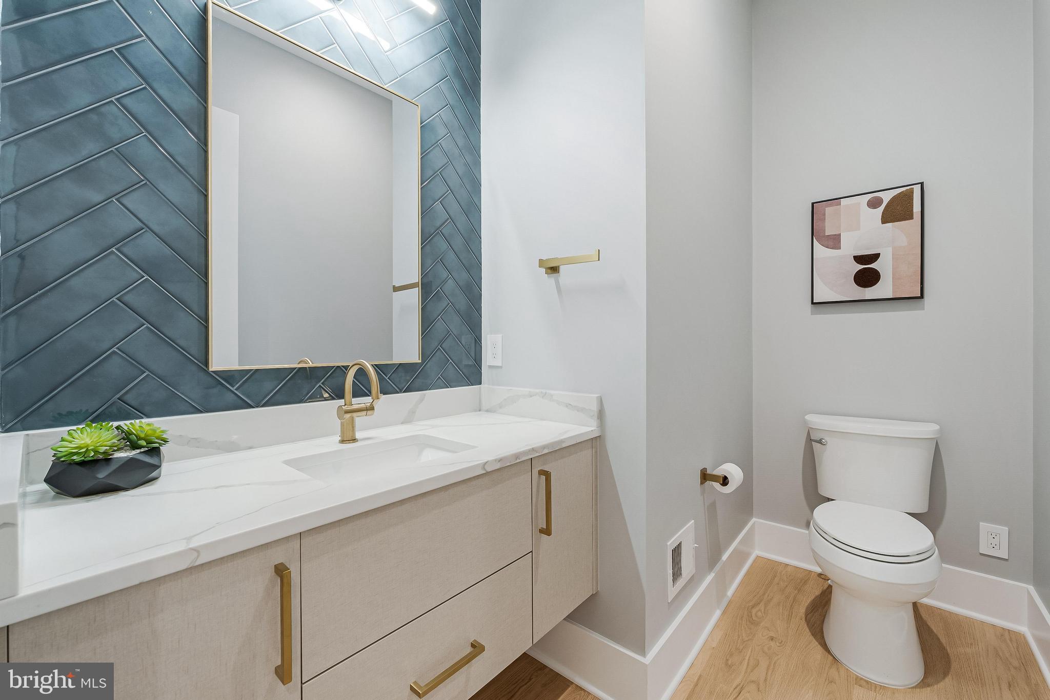 1052 Balls Hill Road McLean, VA 22101 - Photo 15 of 41 a bathroom with a toilet sink and mirror