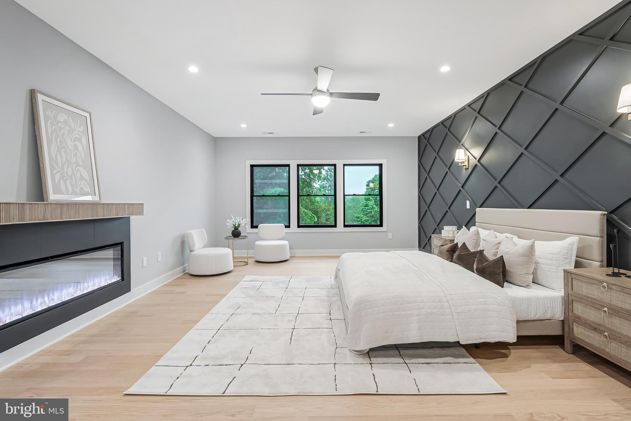 1052 Balls Hill Road McLean, VA 22101 - Photo 24 of 41 a bedroom with a large bed and a chandelier