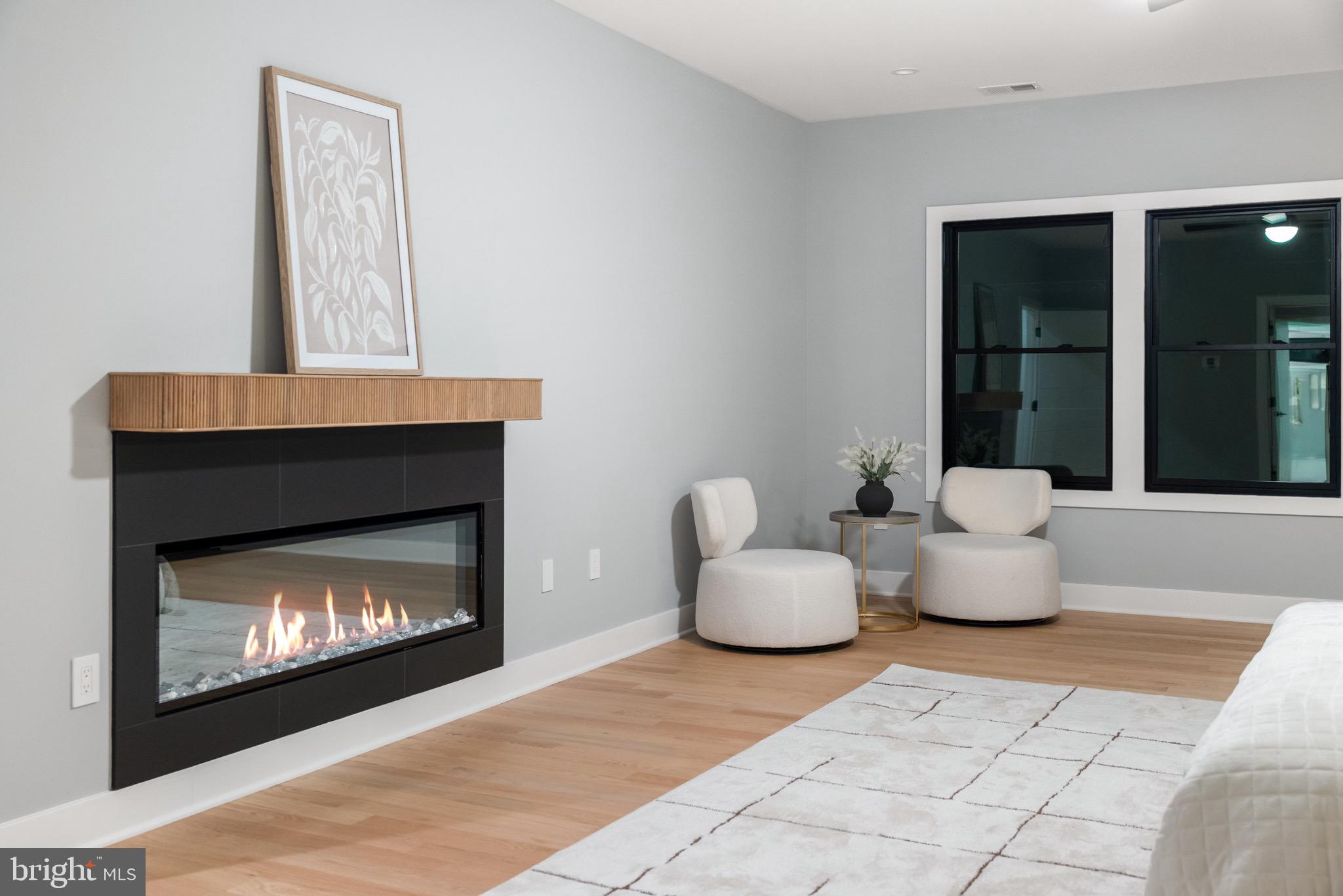 1052 Balls Hill Road McLean, VA 22101 - Photo 25 of 41 a living room with furniture and a fireplace