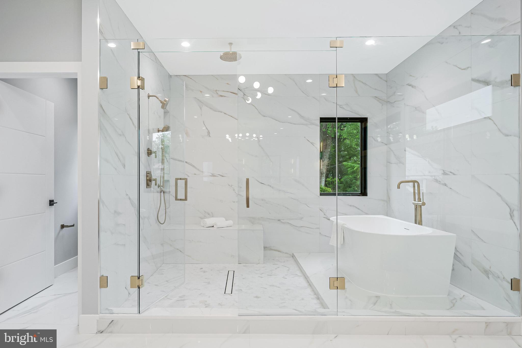 1052 Balls Hill Road McLean, VA 22101 - Photo 26 of 41 a bathroom with a bathtub a shower a sink and mirror