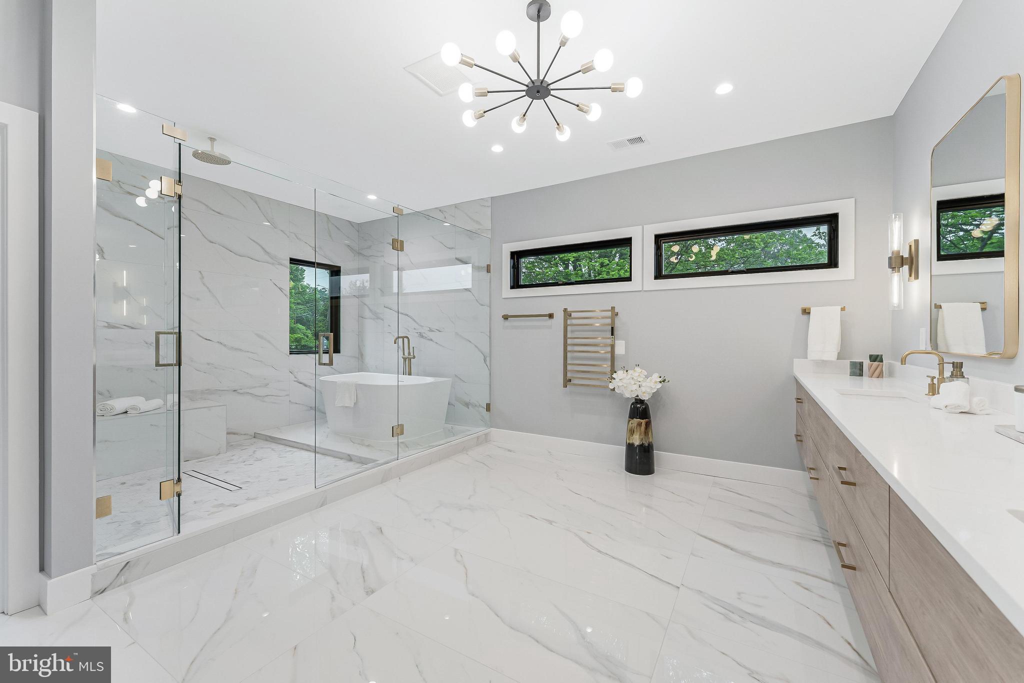1052 Balls Hill Road McLean, VA 22101 - Photo 27 of 41 a bathroom with a tub a sink and mirror