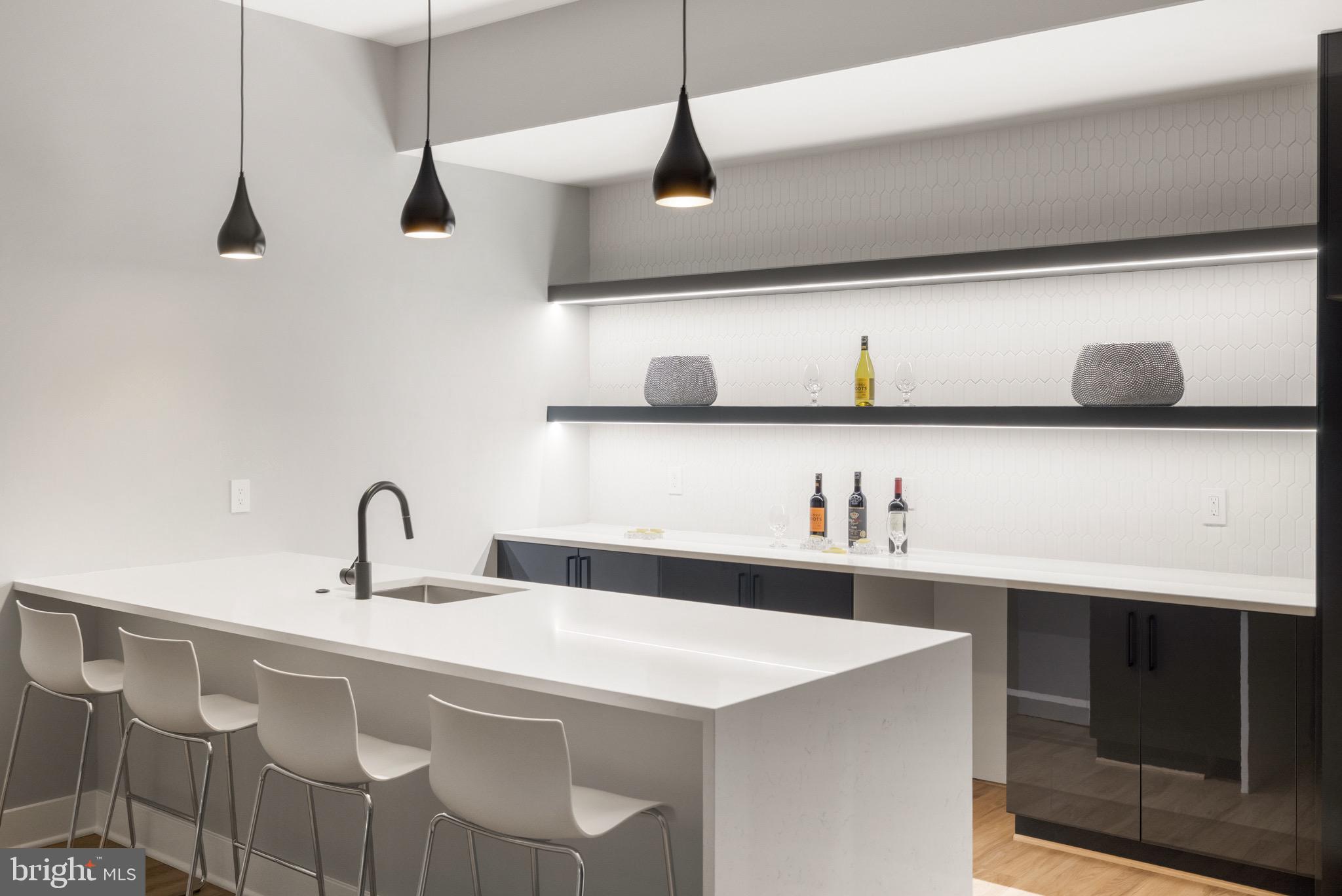 1052 Balls Hill Road McLean, VA 22101 - Photo 34 of 41 a kitchen with a sink a refrigerator and cabinets