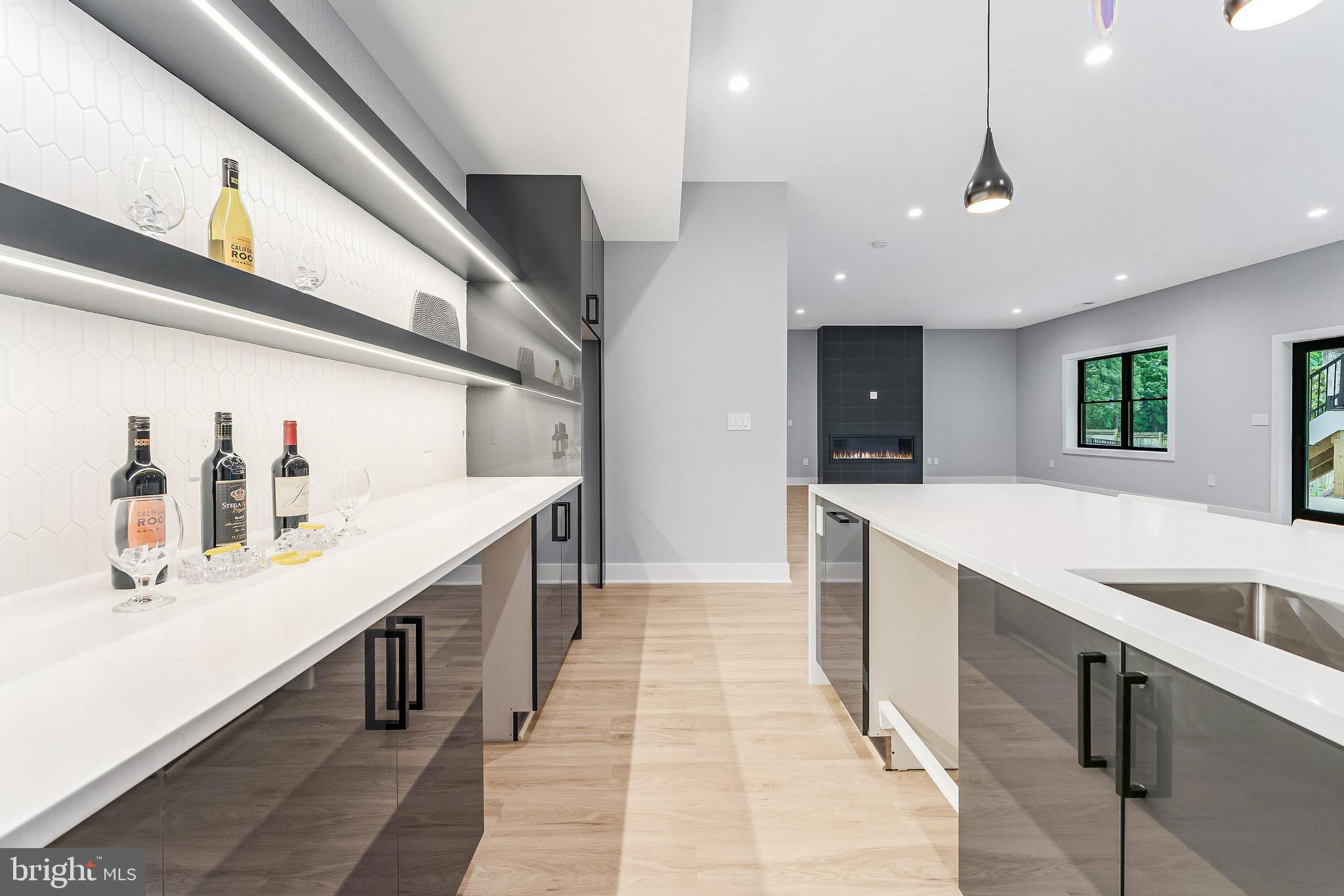 1052 Balls Hill Road McLean, VA 22101 - Photo 38 of 41 a kitchen with stainless steel appliances kitchen island granite countertop a sink and cabinets