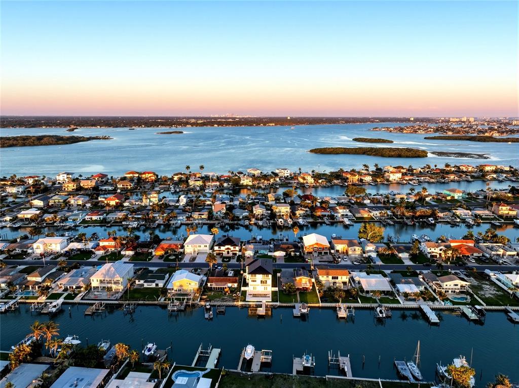 534 Crystal Drive Madeira Beach, FL 33708 - Photo 64 of 68 an aerial view of a city with lots of residential buildings