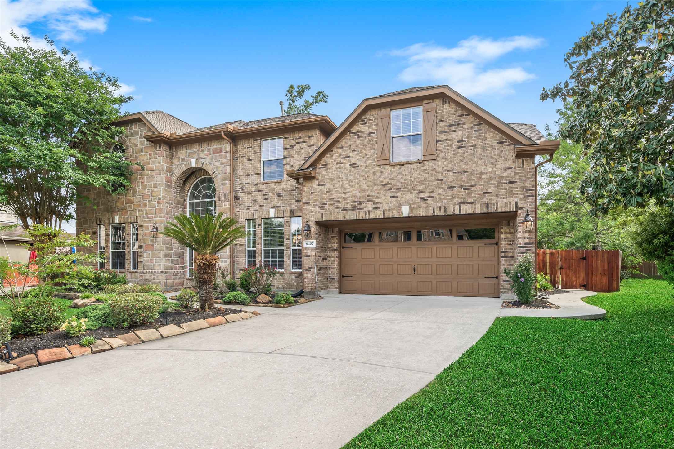 Ready for Summer! This beautiful STONE and BRICK home has it ALL!