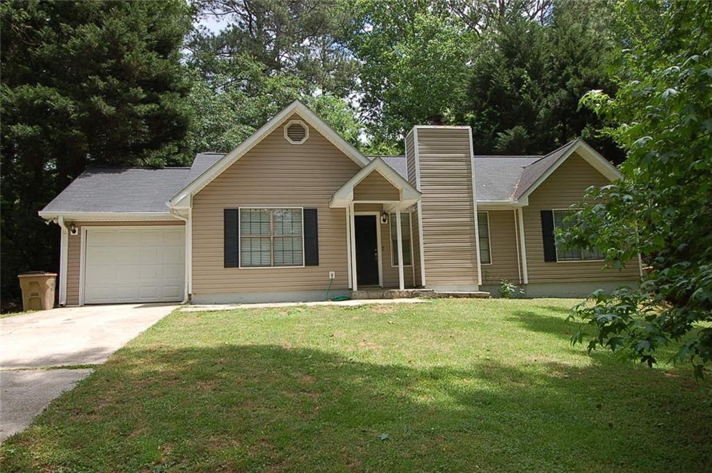166 Old Atlanta Road Stockbridge, GA 30281 - Photo 1 of 1 a front view of a house with yard and trees