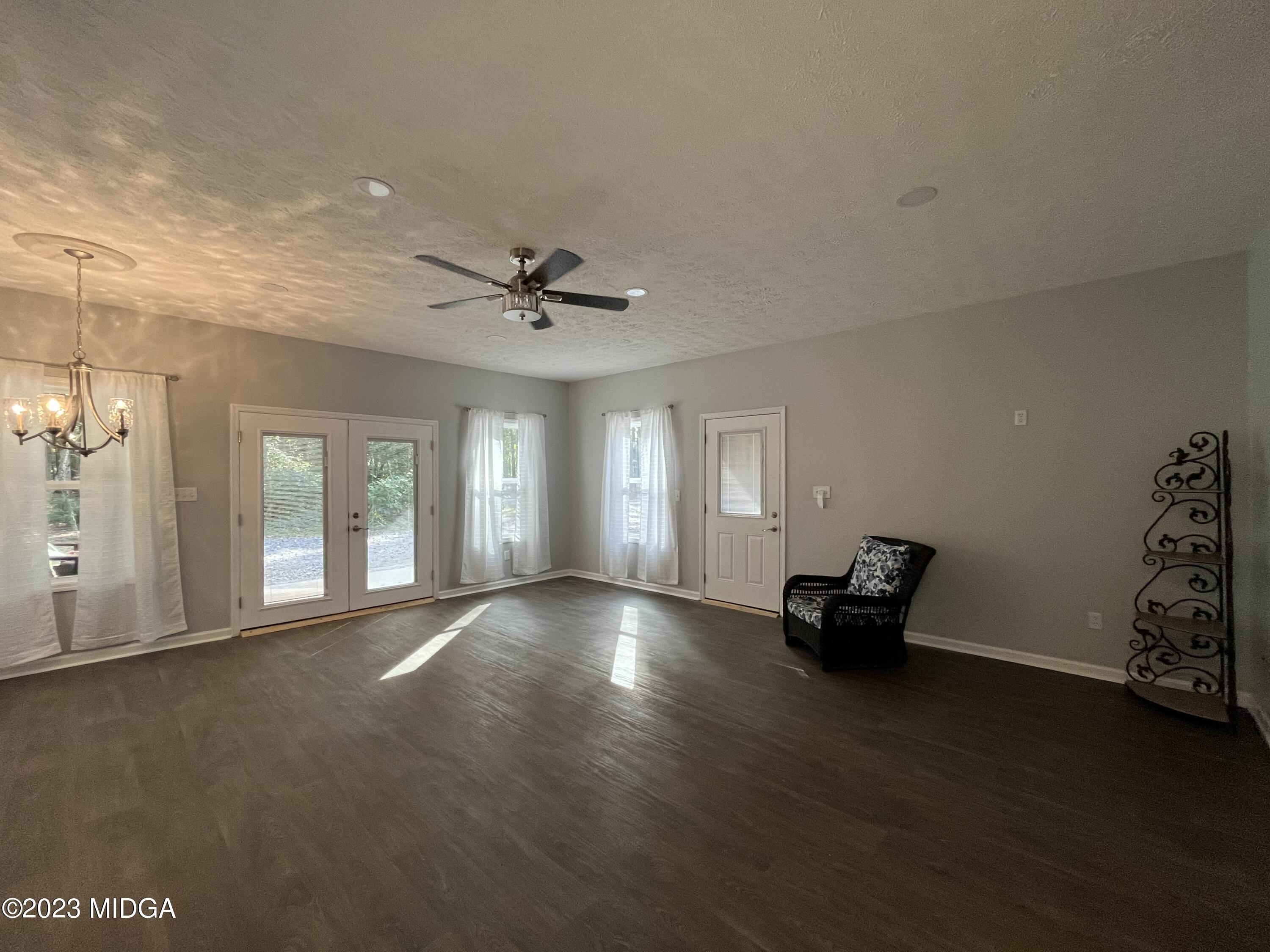 368 Mott Road Barnesville, GA 30204 - Photo 7 of 17 a view of an empty room with a window