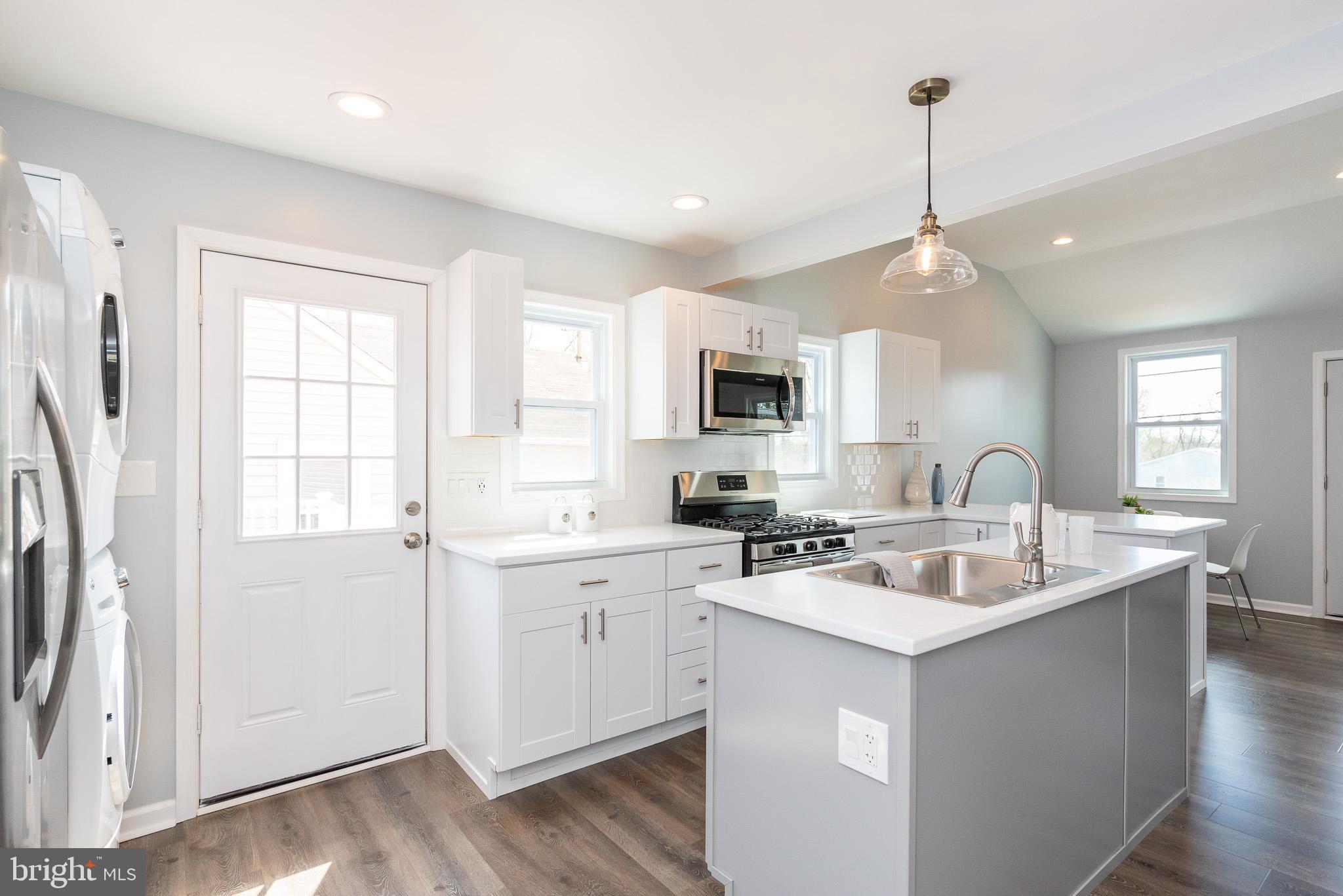 800 Rosedale Avenue Rosedale, MD 21237 - Photo 21 of 44 Kitchen w/Door to the Lovely Deck/Entertaining