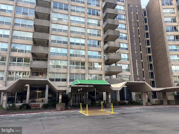 a front view of a building with street view