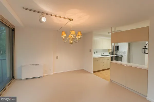 a kitchen with cabinets and window