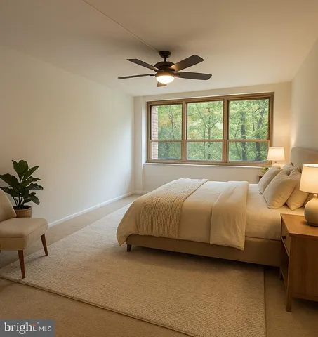 a spacious bedroom with a bed and a potted plant