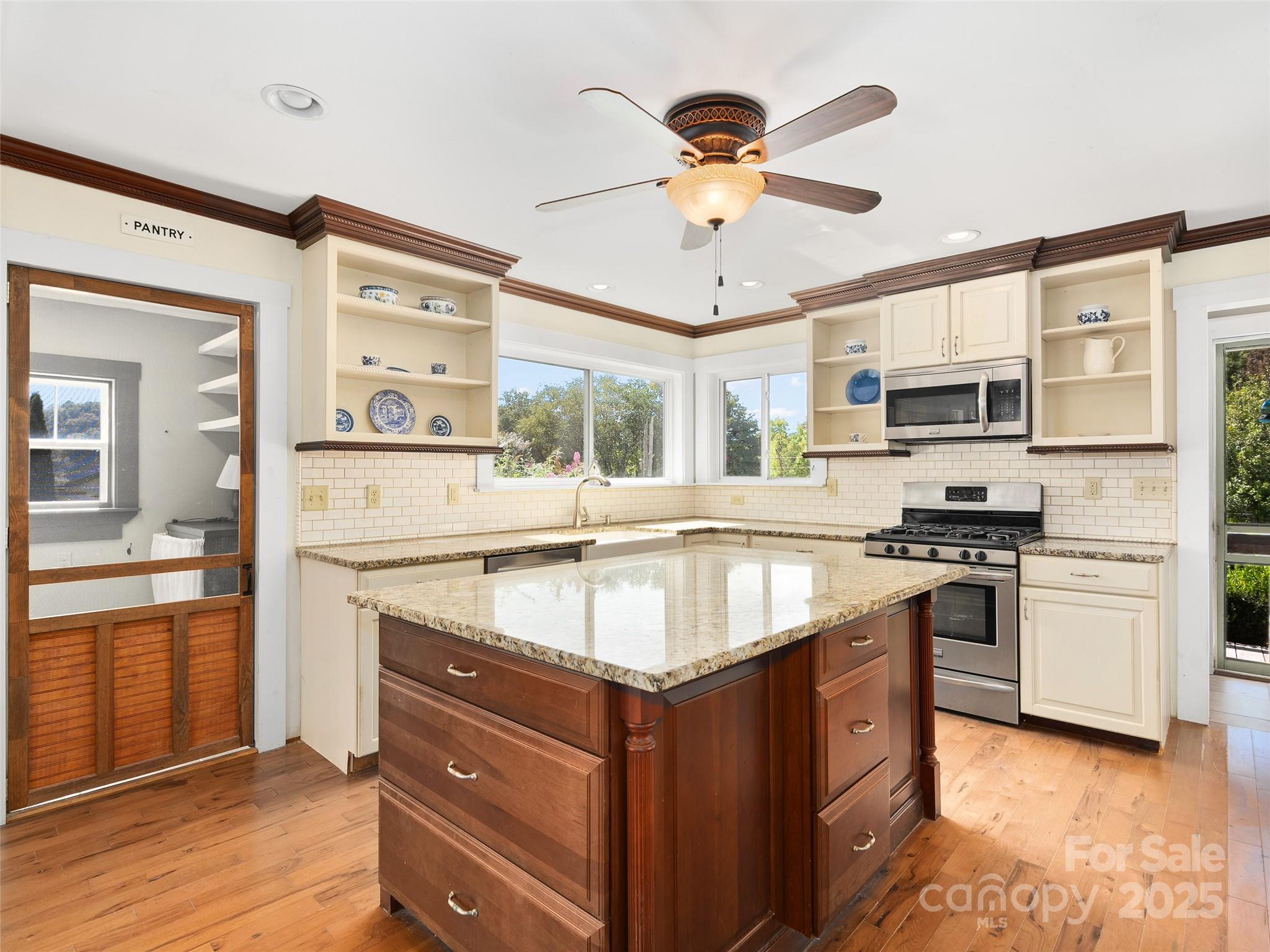 4912 Pigeon Road Waynesville, NC 28786 - Photo 13 of 38 a kitchen with stainless steel appliances granite countertop a stove and a sink