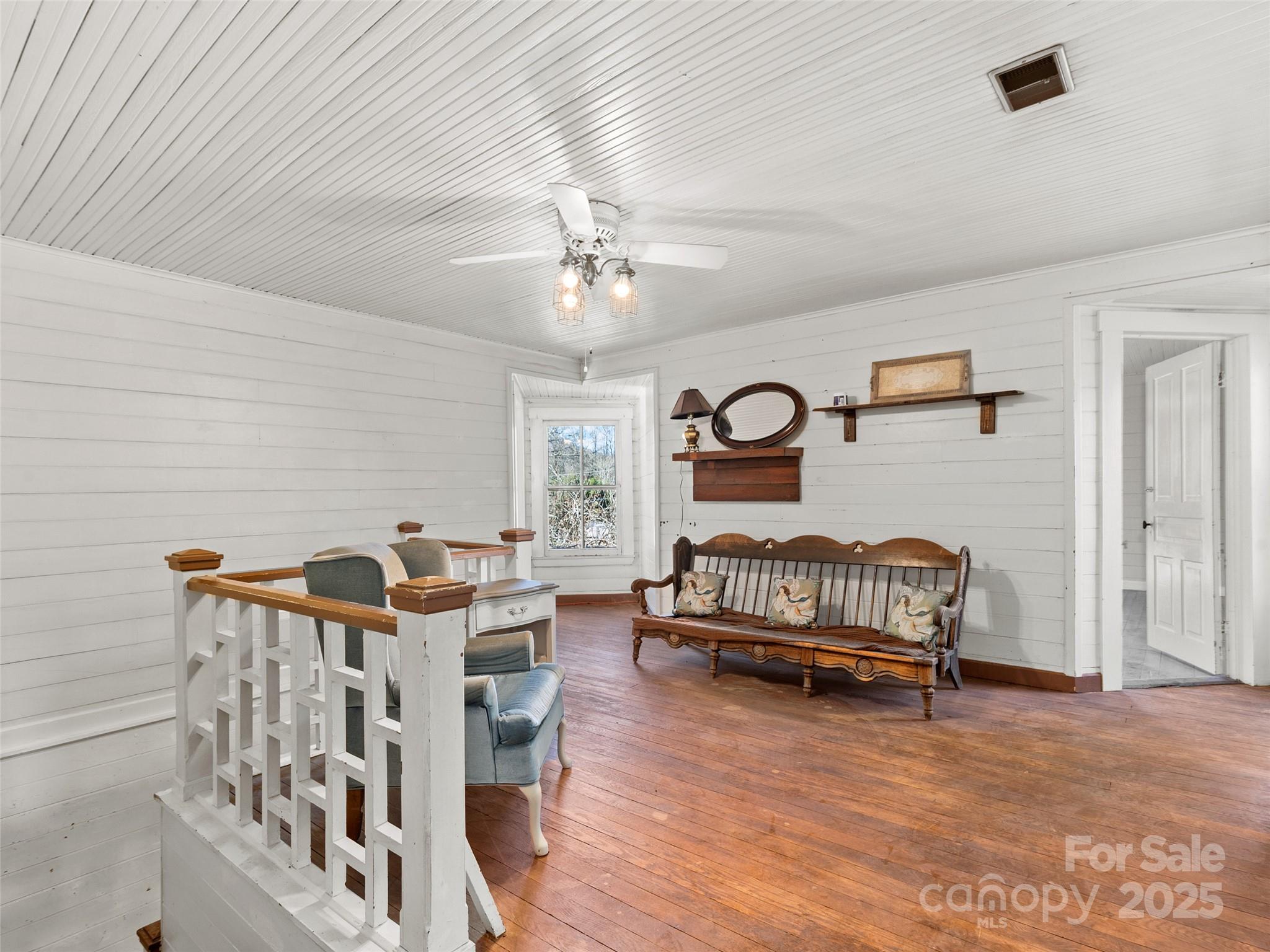 4912 Pigeon Road Waynesville, NC 28786 - Photo 21 of 38 a bedroom with furniture and window