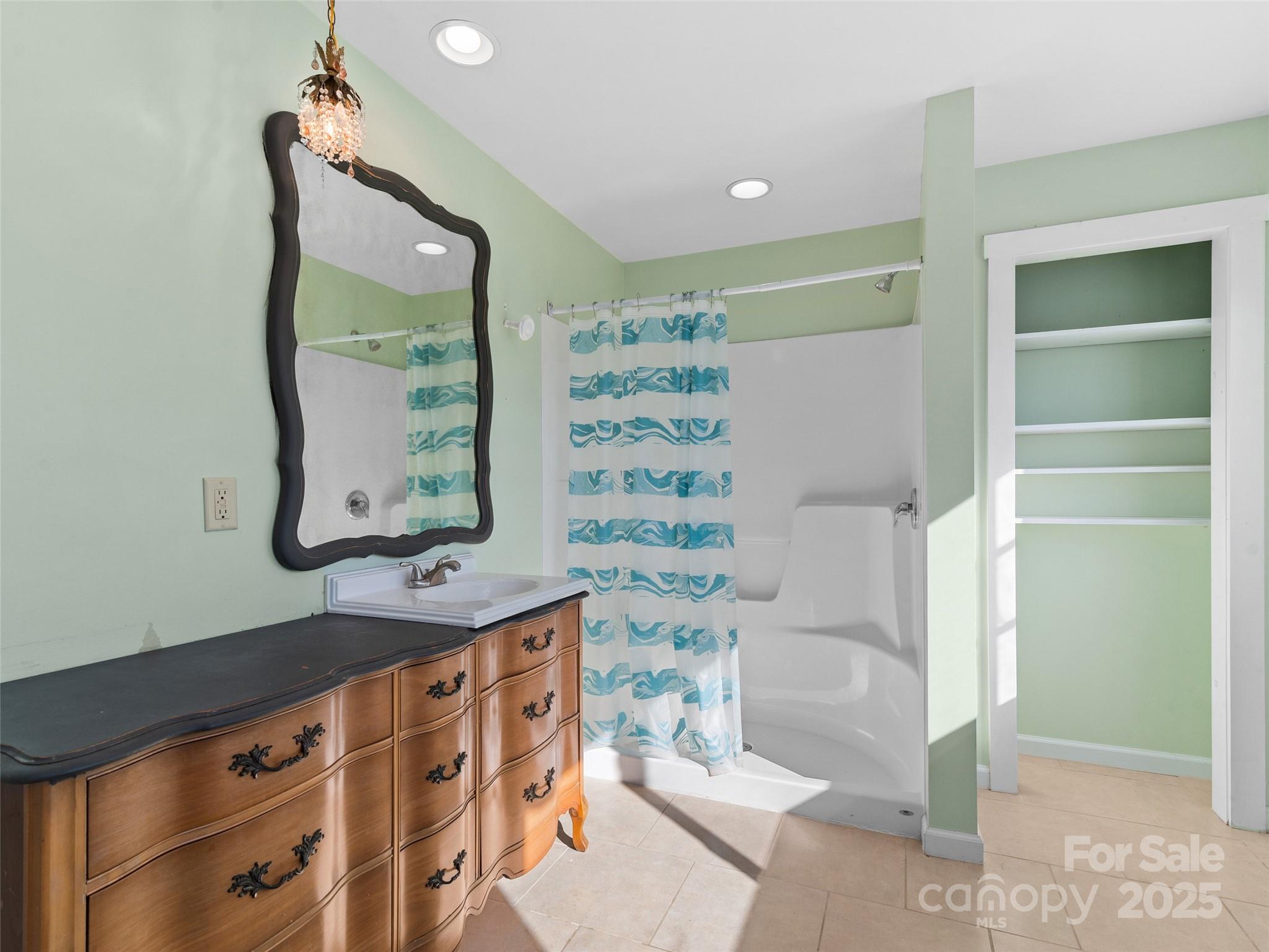 4912 Pigeon Road Waynesville, NC 28786 - Photo 26 of 38 a bathroom with a bathtub and a shower