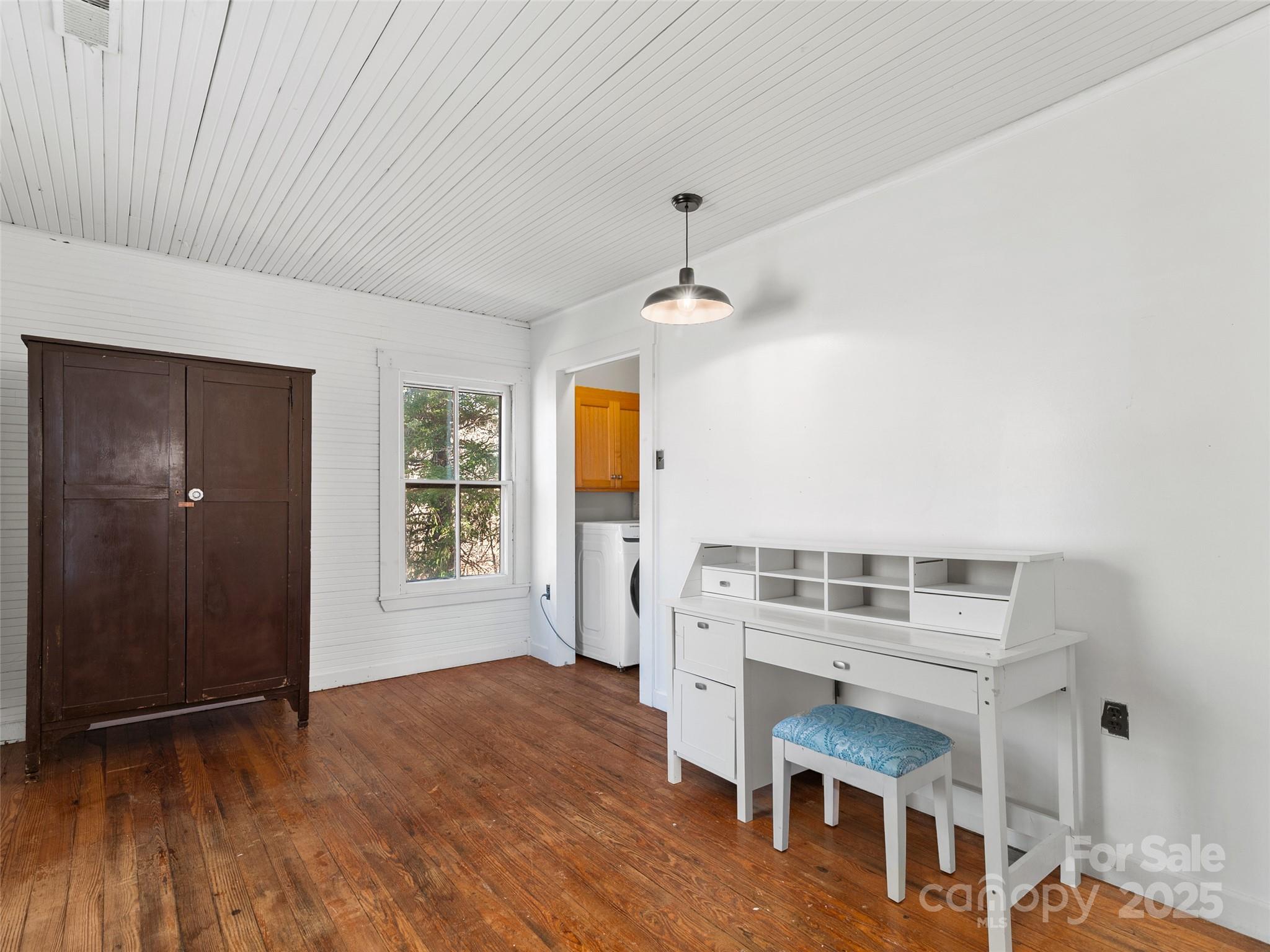 4912 Pigeon Road Waynesville, NC 28786 - Photo 36 of 38 wooden floor in an empty room with a window
