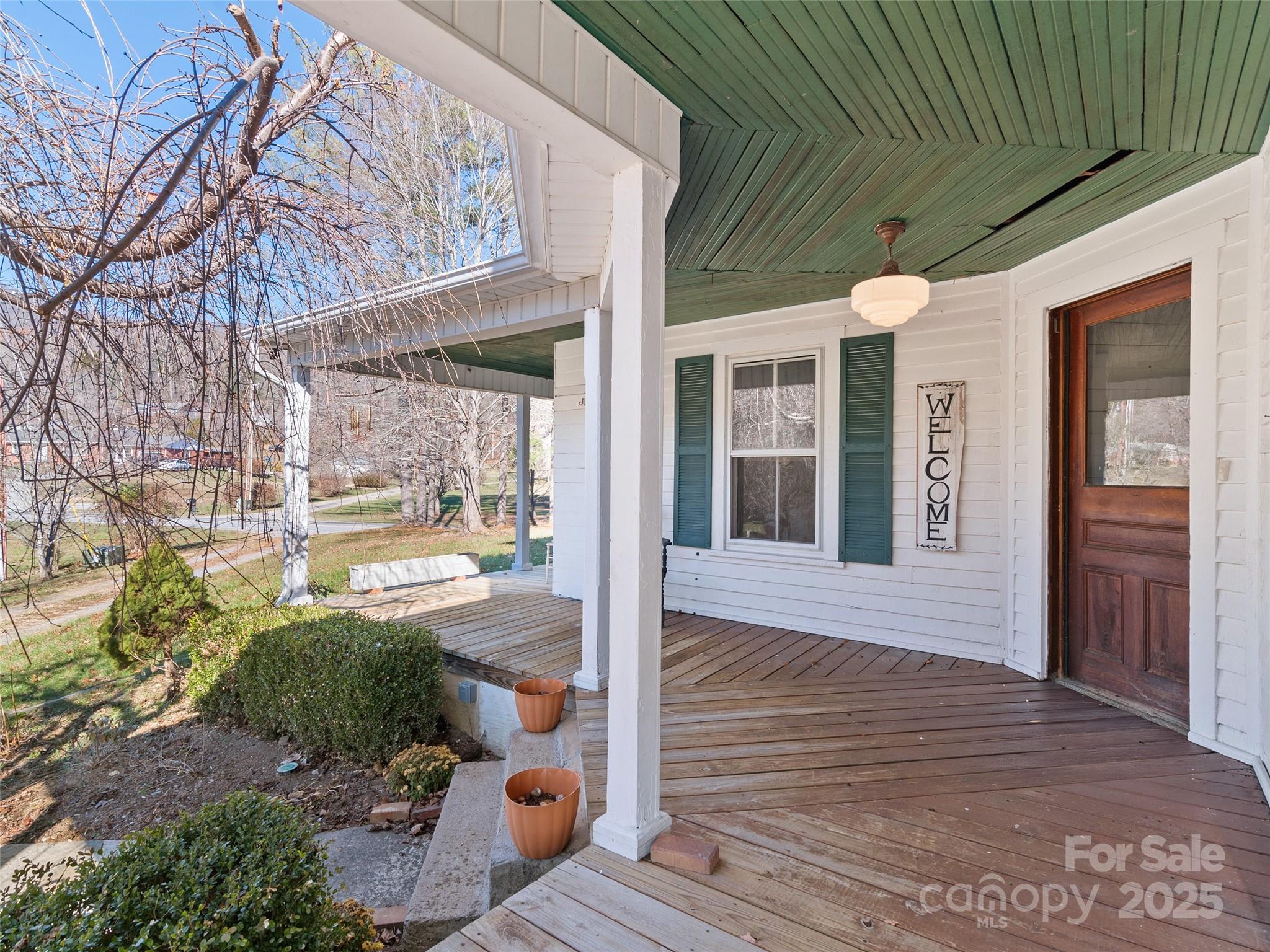 4912 Pigeon Road Waynesville, NC 28786 - Photo 9 of 38 a view of a porch with wooden floor